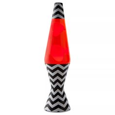 a black and white chevroned cone with an orange top is shown in front of a white background