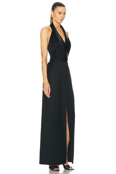 Find SIMKHAI Janice Tuxedo Halter Vest Gown on Editorialist. SIMKHAI Janice Tuxedo Halter Vest Gown in Black Self 1: 49% wool 49% polyester 2% polyurethane Self 2: 89% acetate 11% polyester Self 3 & Lining 1: 100% polyester Lining 2: 55% polyester 45% viscose. Made in China. Dry clean. Fully lined. Hidden side zipper closure. Halterneck styling with adjustable back strap. Plunging neckline with surplice bust. Twill and satin fabric with slip pocket at breast and side seam pockets. JSIM-WD587. 224-1142-U. About the designer: New York born and raised designer, Jonathan Simkhai started his fashion fascination at the early age of 14 where he built his buying skills working at a local retail clothing store. He took his love for the industry and went on to attend Parsons and FIT. His self titled Silk Fitted Maxi Dress For Black-tie Events, Formal Full-length Gala Gown, Silk Fitted Gown For Black-tie Events, Silk Maxi Dress For Black-tie Events, Formal Gown With Back Opening And Maxi Length, Silk V-neck Gown For Formal Occasions, Silk Floor-length Gown For Gala, Silk Floor-length Gala Gown, Formal Full-length Dress With Back Opening