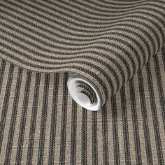 a close up view of a wallpaper with black and white stripes on the floor