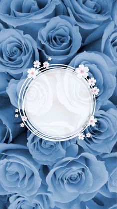 a bunch of blue roses with a white circle in the middle