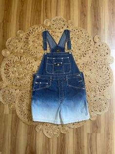 "Awesome pair of Y2K denim ombré shortalls overalls. Cute embroidered floral detail. Marked a size Large. Metal buttons at the hips. Adjustable straps. Pockets in the back. Classic and timeless style. So cute. By Route 66.  In good vintage condition.  Measurements taken while item was laying flat.  Bust: Can vary a bit due to the overall style.  Waist: 20\" Hips: 22\" Length: 33.5\" Can be made shorter or longer." Light Wash Cotton Overall Shortalls, Light Wash Cotton Shortalls, Medium Wash Cotton Overall Shortalls, Cotton Medium Wash Shortalls Overalls, Cotton Medium Wash Shortalls, Spring Shortalls In Dark Wash, Spring Dark Wash Washed Shortalls, Spring Bib Front Dark Wash Shortalls, Summer Medium Wash Bib Front Shortalls