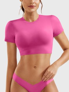 This adorable super-cropped top is designed to enhance your body proportions with a flattering fit. The double-layer lining ensures opacity, making it a versatile wardrobe essential for fitness, yoga, and casual outings.   Feature     Super Cropped Length  Short sleeve, breathability, and comfort  Double-lined, anti-see-through  Skin-friendly for body shaping  Versatile for any occasion     Fabric    73% Nylon + 27% Spandex    Model Measurements    Model Wear: S   Height: 173cm / 5'7"   Bust: 87 Solid Cropped Activewear With Built-in Bra, Cropped Summer Activewear For Pilates, Summer Cropped Activewear For Pilates, Cropped Activewear For Pilates In Summer, Casual Crop Top With Built-in Bra For Pilates, Stretch Crop Top For Pilates, Pink High Stretch Crop Top With Built-in Bra, Pink Crop Top With Built-in Bra And High Stretch, Summer Cropped Top For Pilates