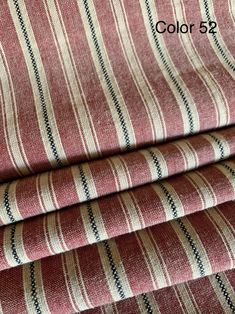 red and white striped fabric with black stripes on the bottom, in three different colors