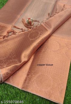 Copper coloured tissue zari woven soft silk saree with broad copper woven zari border. It is easy to drape, easy to maintain, can be comfortably worn at parties and all formal occasions. Goes well with traditional earrings or jhumkas.  Stitching facility for falls-zigzag available on request, free of cost.  Dimensions - 6.3m length, saree length 5.5m, running blouse piece 0.8m. Best quality Copper Color Saree, Copper Zari Silk Saree, Copper Silk Saree, Copper Saree, Silk Tissue Saree, Engagement Saree, Saree Ideas, Saree Sale, Cinnamon Color