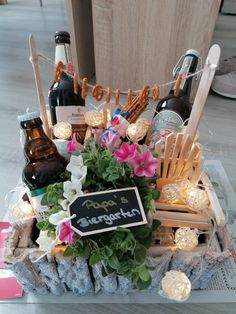 a table topped with lots of bottles and flowers