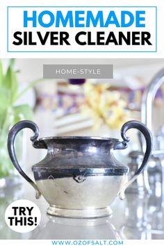 a silver vase sitting on top of a counter next to a faucet with the words homemade silver cleaner