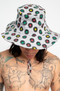 Description: Stay cool and stylish during those summer reggae music concerts or festivals with this Rasta Vinyl Records Boonie Hat! This multifunctional hat is perfect for any outdoor activities – from hikes to beach trips and even music festivals. The classic boonie-style shape with its wide brim provides great protection against the sun and offers a stylish edge to any outfit. Made from 100% cotton canvas, this adjustable hat comes with a drawstring and chin strap to ensure the perfect fit. Fe Casual Bucket Hat For Summer Outdoor Activities, Casual Summer Bucket Hat For Outdoor Activities, Multicolor Wide Brim Bucket Hat For Outdoor, Casual Short Brim Festival Hats, Casual White Hat For Festival With Wide Brim, Fun Multicolor Hats For Outdoor Activities, White Casual Wide Brim Hat For Festivals, Festival Cotton Sun Hat With Short Brim, Fun Flat Brim Hats For Festivals