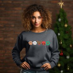 Get ready to sleigh the holiday fashion game with our Christmas Dog Paw Sweatshirt! 🐾🎅 Unleash your inner paw-ty animal with gingerbread, snowman, reindeer, Santa, and elf dog paws. 🐶❄️🦌 🌈 Available in a rainbow of colors and sizes from infant to adult 5X, this cozy sweatshirt is perfect for all dog lovers. 🐕💖 It's not just a sweatshirt; it's a dog lover's dream come true! 🐾🐶 Whether you're a dog mom or a dog enthusiast, this is the ultimate Christmas dog sweatshirt to make tails wag an Winter Dog Print Crew Neck Top, Casual Dog Print Sweatshirt For Winter, Winter Crew Neck Top With Dog Print, Casual Winter Sweatshirt With Dog Print, Gingerbread Snowman, Ty Animals, Reindeer Dog, Ultimate Christmas, Dog Sweatshirt