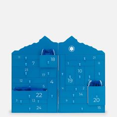 a blue wall mounted calendar with two pockets on the front and one pocket in the back