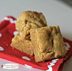 two peanut butter squares sitting on top of a red napkin