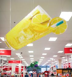 a lemonade drink hanging from the ceiling in a store