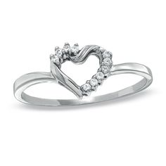 a white gold heart shaped ring with diamonds