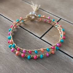 multicolored beaded bracelet on wooden floor