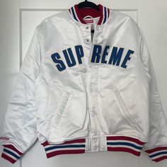 Supreme Bomber Jacket Size Medium Never Been Worn Mint Condition Winter White Varsity Jacket With Ribbed Cuffs, White Hooded Varsity Jacket With Ribbed Cuffs, Casual White Varsity Jacket With Ribbed Cuffs, White Winter Outerwear For Streetwear, White Sporty Hooded Varsity Jacket, Casual White Varsity Jacket For Winter, White Long Sleeve Varsity Jacket For Winter, White Varsity Jacket For College In Fall, White Hooded Varsity Outerwear