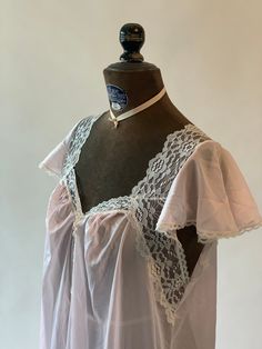 "Vintage 1990s pink and off white / cream lace trim nightgown. Gathered at bust. Tags read Sopre Lingerie, Medium. Measurements: Bust: 40\" Waist: 46\" Hips: 50\" Shoulder to hem: 54\"" Feminine Cream Nightgown With Lace Trim, White Lace Chemise For Bedtime, White Lace Nightgown With Lace Trim, White Nightgown With Delicate Lace, White Lace Nightgown For Night, White Lace Trim Coquette Nightgown, Vintage Nightgown With Delicate Lace For Wedding Night, Cream Nightgown With Lace Trim For Bedtime, White Coquette Nightgown With Lace Trim