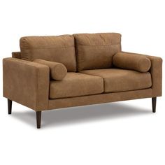 a brown couch sitting on top of a white floor