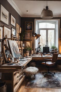 a home office with lots of art on the walls