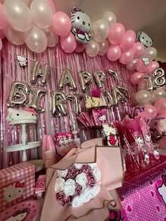 a hello kitty themed birthday party with balloons