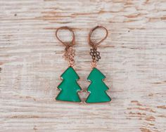 This green Christmas tree earrings will add holiday mood to your look.Size:around 4.5 cm / 1 6/8"*Please give an allowance for slight difference in size, shape and tint since each piece is individually handmade.*Each purchase comes carefully packaged and is ready-to-gift.*Please note that real colors may slightly differ from their appearance on your display.You might also like:Other Earrings: http://etsy.me/14NiAkk Holiday Earrings, Tree Earrings, Christmas Tree Earrings, Holiday Mood, Earrings Christmas, Green Christmas Tree, Holiday Earring, Earring Tree, Tampa Fl