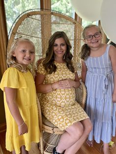 two girls and an older woman posing for the camera