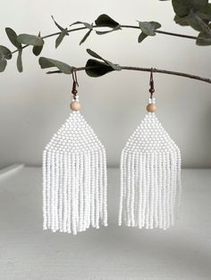 "White beaded earrings for your beautiful holiday look. These are a cute bohemian earrings made with love for you. It also makes an excellent gift for Easter, birthdays, anniversaries, mother's day, valentine's day and more. ♡ Bead Length - 8 cm (3'') ♡ Total Length - 9.5 cm (3,5\") ♡ Width - 3 cm (1\") ♡ Quality Czech beads ♡ Stainless steel mounts If you like these long seed beads earrings, but would like them in a different color please email me and I do special orders. I accept payments thro White Tassel Chandelier Drop Earrings, White Dangle Beaded Earrings With Tassels, Bohemian White Tassel Earrings For Gift, White Bohemian Tassel Earrings For Gift, Bohemian White Tassel Earrings As Gift, White Dangle Tassel Earrings As Gift, Handmade White Tassel Drop Earrings, White Tassel Beaded Drop Earrings, White Dangle Jewelry With Tassels