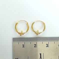 Bali style sterling silver ear hoops dipped in real gold. Dimensions: 1.2 x 12 mm Price listed is for a pair of ear hoops. These earrings are made of 925 hypoallergenic sterling silver. All my pieces are sent in a gift box. I can include a personal message from you if needed. You are welcome to contact me at... bhavnakwintra1956@gmail.com More hoops: https://www.etsy.com/your/shops/TheSilverGame/tools/listings/section:26305414 More earrings: https://www.etsy.com/your/shops/TheSilverGame/tools/li Handmade Gold Hoop Septum Ring, Handmade Gold Hoop Nose Rings, Handmade Small Hoop Gold Nose Rings, Handmade Gold Small Hoop Nose Rings, Gold Hypoallergenic Small Hoop Nose Rings, Hypoallergenic Small Hoop Gold Nose Rings, Small Gold Hoops, Evil Eye Earrings, Thread Earrings