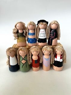 a group of wooden dolls sitting next to each other