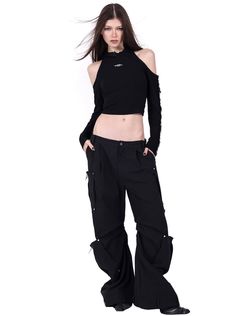 Edgy black crop top with a unique asymmetric design. Features a single long sleeve and an off-shoulder cut on the opposite side. Integrated hood with delicate lace trim for a feminine touch. Small metallic brand logo on the chest. Made from a soft, stretchy fabric for comfort. The raw, frayed edges along the sleeve add a punk-inspired element. Model info Height: 176cm Weight: 49kg Wearing size: M Fall Crop Top For Alternative Fashion, Hooded Crop Top, Punk Inspiration, Black Crop Top, Shoulder Cut, Isle Of Man, Asymmetrical Design, Girly Fashion, Black Crop