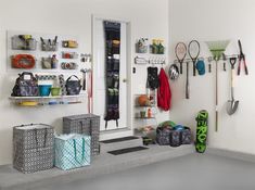 there are many different items on the shelves in this room, including umbrellas and baskets