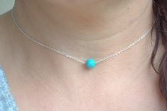 single turquoise bead necklace, sterling silver dainty necklace, tiny gemstone necklace Tiny turquoise bead necklace. Materials: - natural blue turquoise bead - 8 mm . - sterling silver delicate chain - silver components - because I use natural materials, they bead may vary in shape, size and color. Gift boxed. Link to my shop https://www.etsy.com/shop/SilverIrisJewelry?ref=hdr *INTERNATIONAL VAT TAXES & CUSTOMS FEE'S may be charged by your country's customs and/or postal system in order for Minimalist Blue Jewelry With Gemstone Beads, Minimalist Blue Jewelry With Tiny Beads, Sterling Silver Blue Jewelry With Tiny Beads, Turquoise Sterling Silver Jewelry With Delicate Chain, Dainty Turquoise Necklace With Round Beads For Gifts, Dainty Turquoise Necklace With Round Beads As Gift, Blue Sterling Silver Jewelry With Tiny Beads, Minimalist Turquoise Necklace With Round Beads, Blue Sterling Silver Necklaces With Tiny Beads