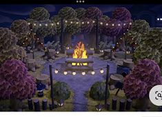 an animated fire pit surrounded by trees and candles