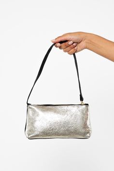 The Embellished Zip Pochette is a pouch shoulder bag with a zipper closure. This artisanal product is made of genuine leather. All scars are characteristics of the skin and not imperfections. We hope you enjoy this unique handmade object.- Brass zipper- Genuine Cowhide- Handmade in the U.S.A. | Embellished Leather Zip Pochette in Silver/Black Snake Black, Gold Snake, Gold Black, Genuine Leather, Im Not Perfect, Pouch, Brass, Shoulder Bag, Zipper