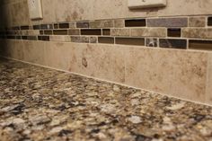 a kitchen counter top with tile on it