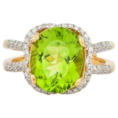 This collection features an array of pretty peridot rings! Accented with diamonds these rings are made in yellow gold and present a vibrant and fresh look. Classic peridot ring in 18K yellow gold with diamonds. Peridot: 4.5 carat oval shape. Diamonds: 0.519 carat, G colour, VS clarity. Gold: 5.44g, 18K yellow gold. Ring Size: US 6.75 - Size can be adjusted for free upon request - please reconfirm with your order. R540 Luxury Brilliant Cut Peridot Jewelry, Luxury Peridot Three Stone Rings, Luxury Peridot Gemstone Ring, Luxury Elegant Peridot Rings, Unique Luxury Peridot Rings, Peridot Rings, 5 Carat Ring, Dream Engagement, Dream Engagement Rings