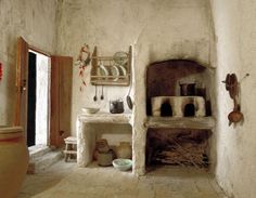 an old fashioned kitchen with pots and pans