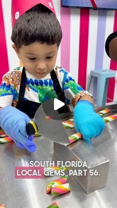 a little boy that is sitting at a table