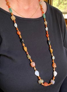 Timeless natural agate gemstone necklace that is at least 50 years old. Agates separated by small agate and gold metal beads to add the sparkle. Gold Aventurine Beaded Necklaces, Gold Single Strand Agate Necklace, Gold Agate Single Strand Beaded Necklace, Gold Agate Beaded Necklace With Polished Beads, Long Agate Crystal Necklace With Natural Stones, Gold Chalcedony Gemstone Beads Necklace, Gold Chalcedony Necklace With Gemstone Beads, Gold Long Necklace With Gemstone Beads, Gold Long Necklace With Natural Stones