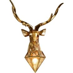 a golden deer head mounted on the side of a white wall with a light bulb in it