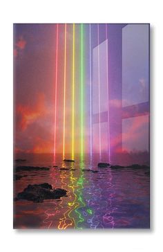 an image of colorful lights reflecting in the water at sunset or sunrise with rainbow colors