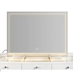 an illuminated vanity mirror with drawers and lights on the sides, in front of a white background