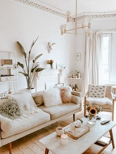 a living room filled with furniture and decor