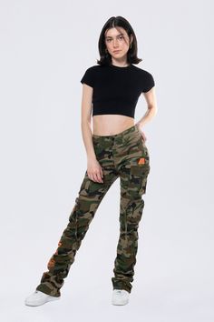 Details Fit: Nova - High Rise, Stacked Fit Color: Wood Camo Material: 97% Cotton / 3% Spandex Style: AP24520EC Military Style Fitted Bottoms For Streetwear, Fitted Military Style Bottoms For Streetwear, Fitted Military Style Pants For Streetwear, Fitted Camouflage Military Pants, Fitted Camouflage Bottoms For Fall, Fitted Camouflage Cargo Pants For Streetwear, Fitted Camouflage Bottoms With Cargo Pockets, Fitted Camouflage Trousers, Fitted Camouflage Pants With Cargo Pockets