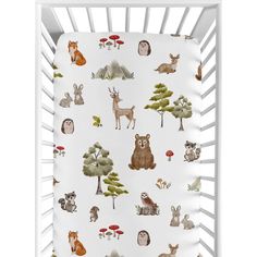 a white crib with woodland animals on it