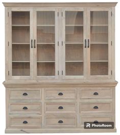 a wooden cabinet with glass doors and drawers on the bottom, in front of a white background