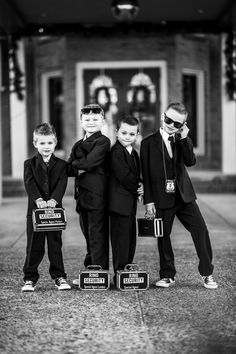 a group of young boys standing next to each other