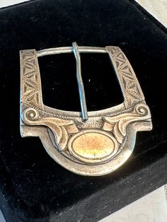 Western buckle silver and gold, unusual artistic vintage design.  Condition is good, wear commensurate with age, unmonogramed, 1" bar for belt.  Size 1 1/2" by 2", wt. 19.2 grams.  Awesome shape and gold design on top, signed with makers mark of a bird which I do not recognize marks DF, FN.  One of the most handsome designs I've seen in a vintage wester Buckle, pictures speak for themselves. Antique Engraved Belt Buckles For Formal Wear, Vintage Silver Engraved Belt, Western Gold Belt With Antique Buckle, Classic Silver Hand-tooled Belt Buckle, Classic Hand Tooled Silver Belt Buckles, Adjustable Engraved Belt Buckles For Western-themed Events, Gold Western Belt With Concho, Western Gold Belt With Concho, Adjustable Engraved Gold Belt Buckles