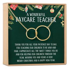 a christmas card with two gold intertwined rings on it and the words,'my favorite art teacher is the season to thank you for all you have done