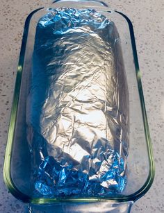 an uncooked casserole dish covered in aluminum foil