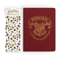 the hogwarts notebook and stickers are next to each other