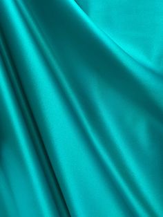 a close up view of a teal colored fabric